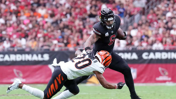 Oct 8, 2023; Glendale, Arizona, USA; Arizona Cardinals running back James Conner (6) runs against Cincinnati Bengals cornerback DJ Turner II (20) during the first half at State Farm Stadium. Mandatory Credit: Joe Camporeale-USA TODAY Sports  